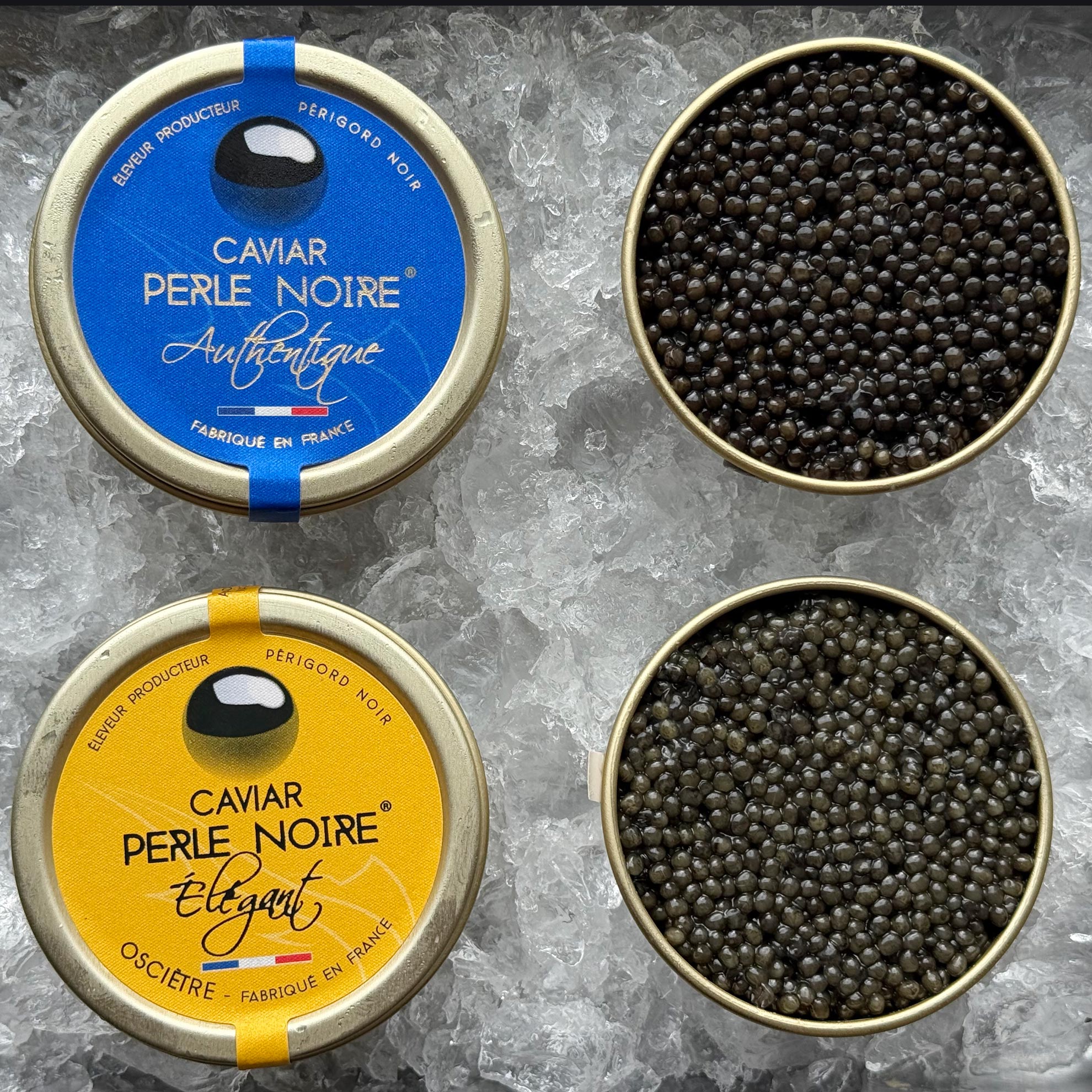 Grøndals Kaviar Duo præsenterer 30 g dåser med L'Élégant (Oscietre) og L'Authentique (Baerii), elegant præsenteret på is i den karakteristiske blå og gule emballage, der viser førsteklasses fransk kaviar.